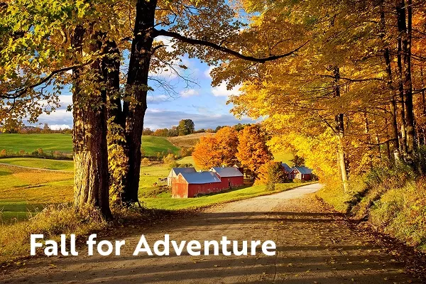 Farmhouse between colorful trees with text overlay "Fall for adventure"