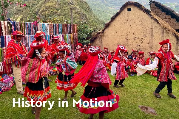 children in colorful woven clothing dancing with text overlay "history in motion"