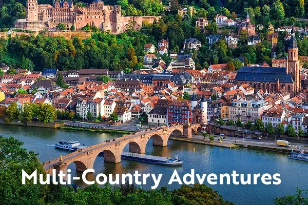 River with bridge and houses on the river bank with text overlay "multi-country adventures"