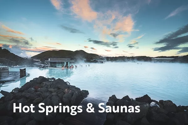 Hot spring surrounded by mountains with text overlay "hot springs & saunas"