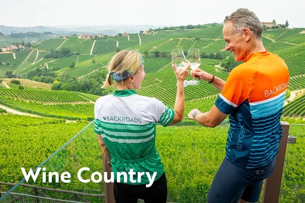 Two backroads guests clink wine glasses with text overlay "wine country"