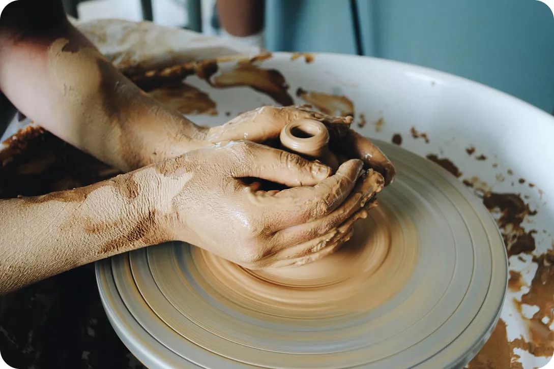 hands working with clay