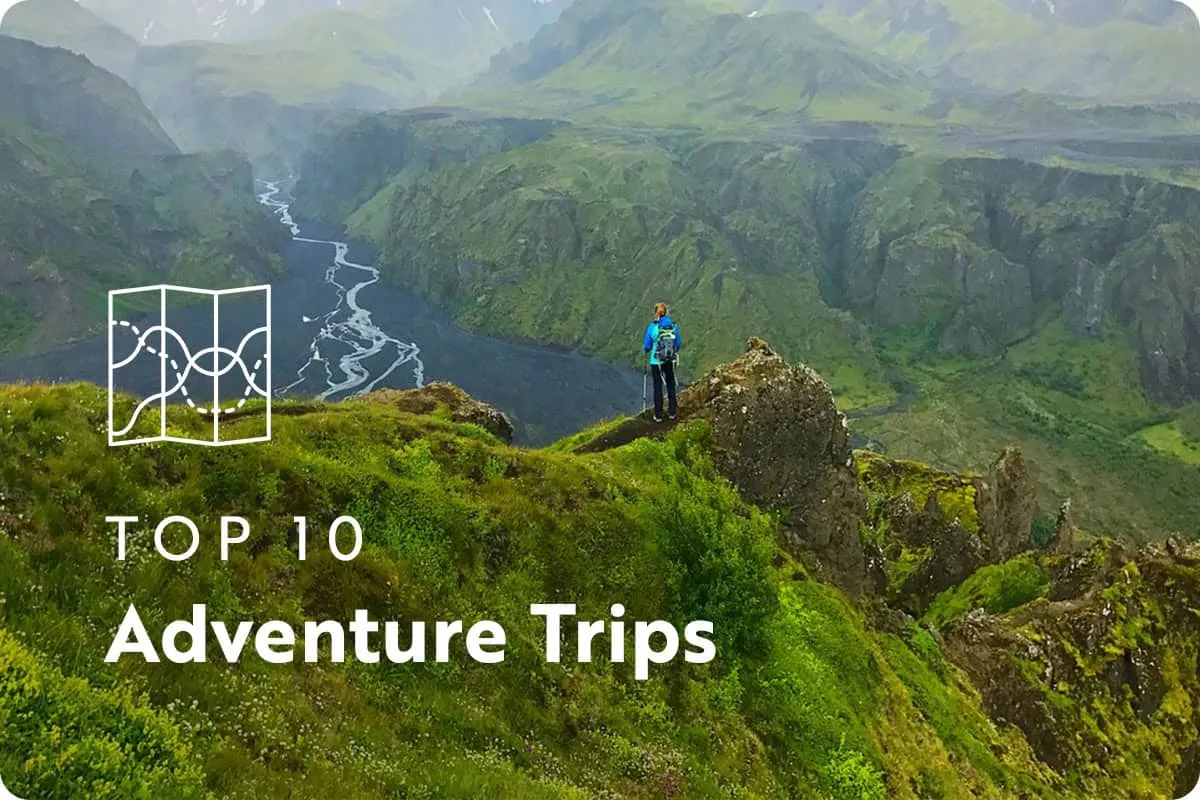 text: top 10 adventure trips; image: green mountains