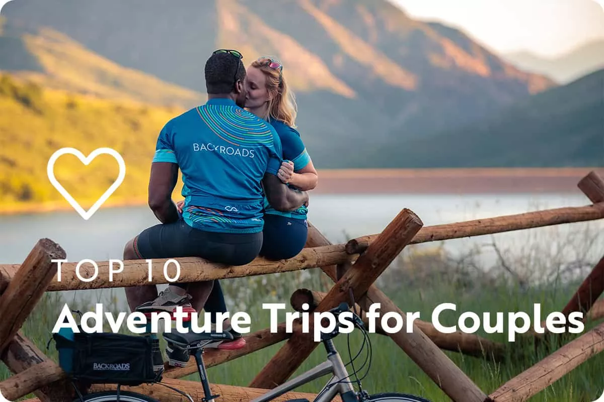 text: top 10 adventure trips for couples; image: two people kissing in front of a lake