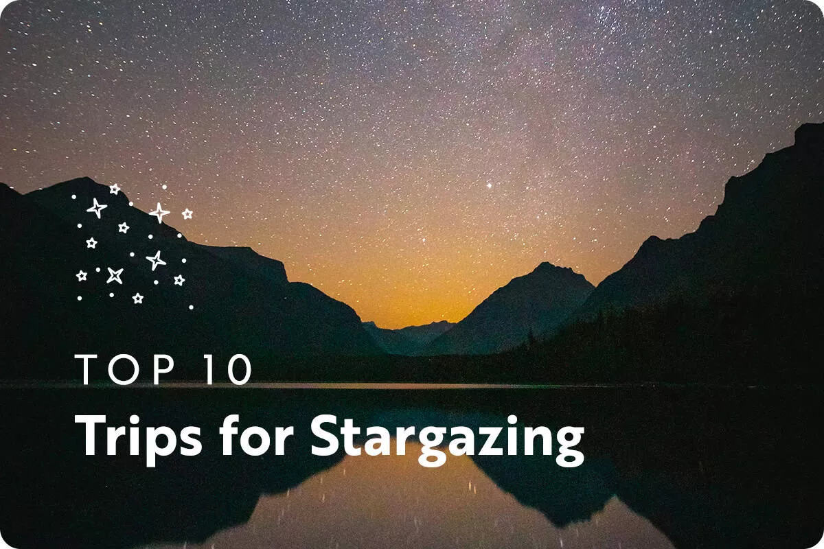 text: top 10 trips for stargazing; image: stars in the night sky