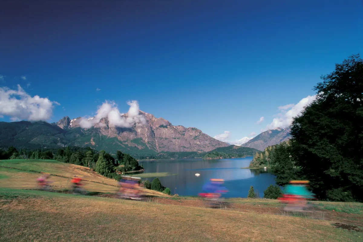 Beach and water in front of snow-capped mountain