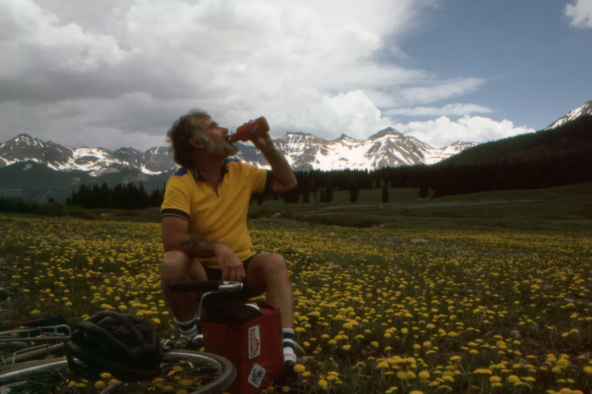 Tom Hale posing for photo in front of mountains