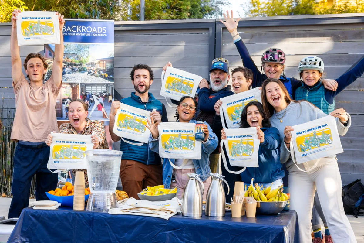 Backroads employees hosting a hydration station on Bike to Wherever Day.