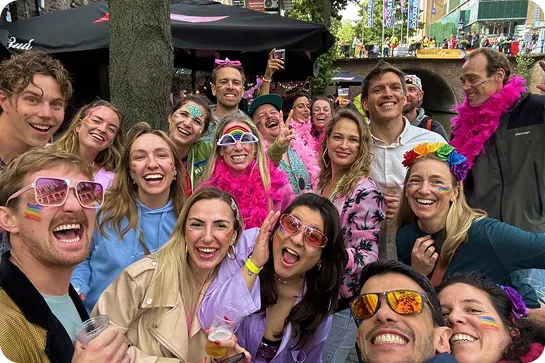 Group of people smiling in a crowd