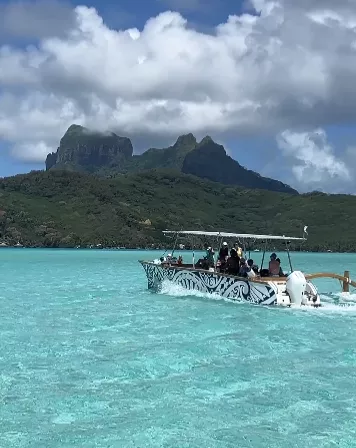 Boat crossing crystal clear water
