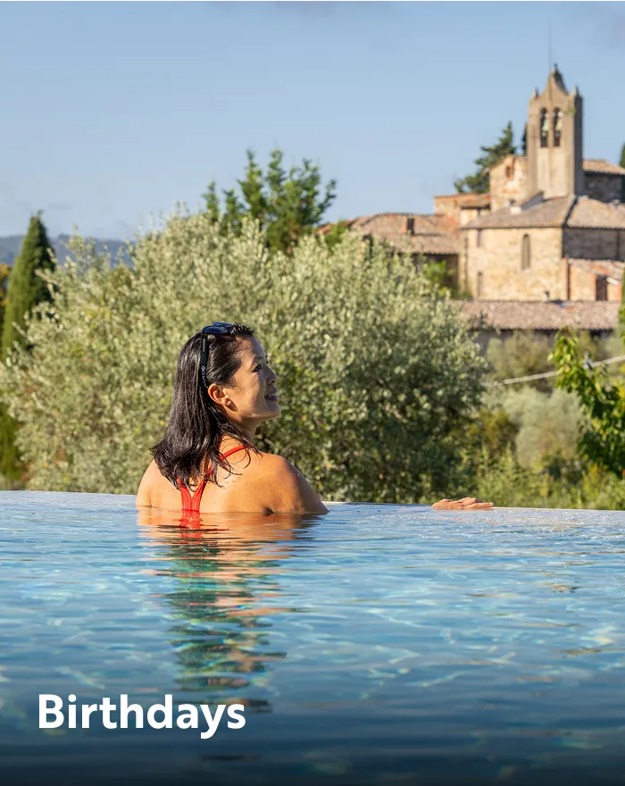 Woman standing on an infinity pool