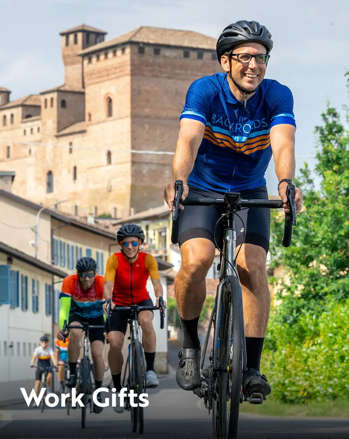 Group of people biking in front of a castle-like building