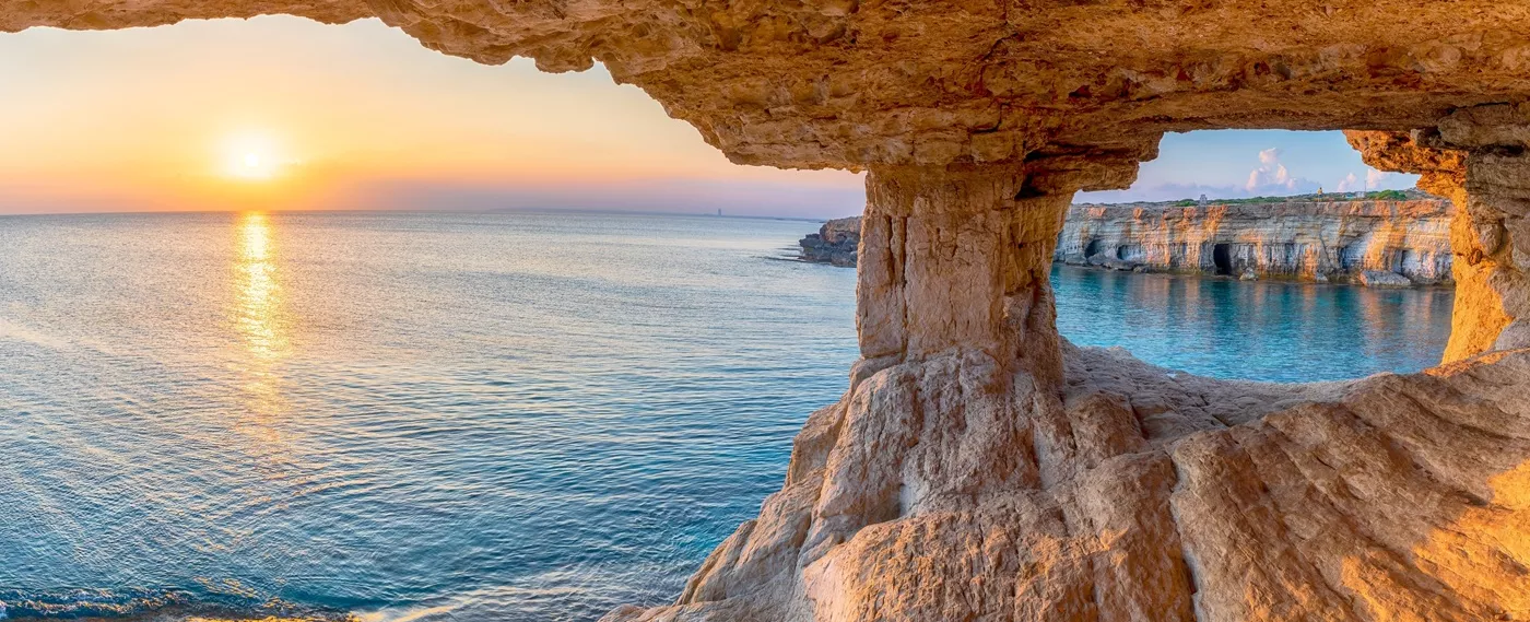 Orange cave with a view of the ocean