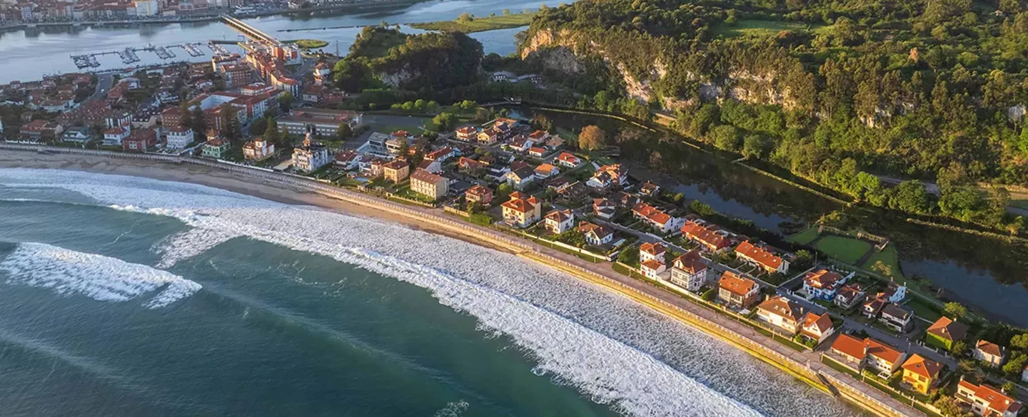 Sky view of a town by the coast of the ocean