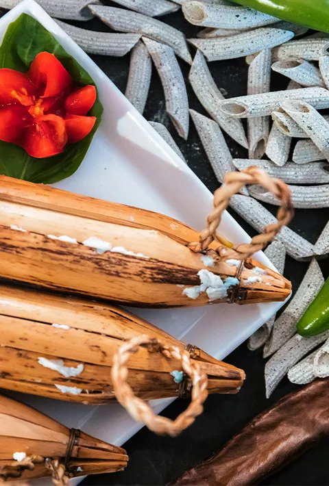 Italian spread of cheese, pasta, peppers, tomato