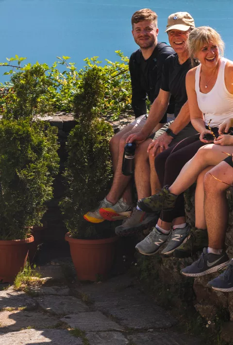 Group sitting on low wall