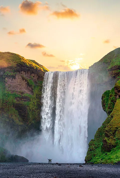 Waterfall surrounded by mossy mountains