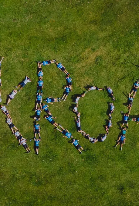 Backroads sign on a field of grass