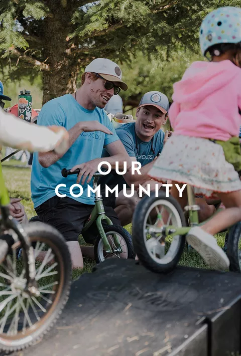 People on bikes, text overlay: our community