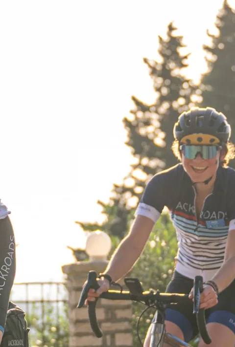Group of people biking with trees in the background