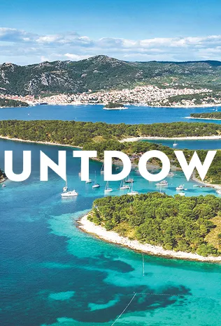 Blue water with grassy islands in it