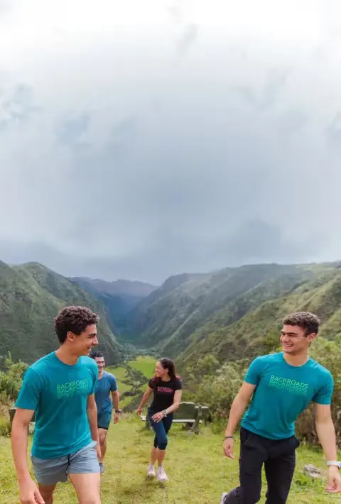 A family hiking in the Andes during a Backroads Galápagos &amp; Andes Family Multi-Adventure Tour.