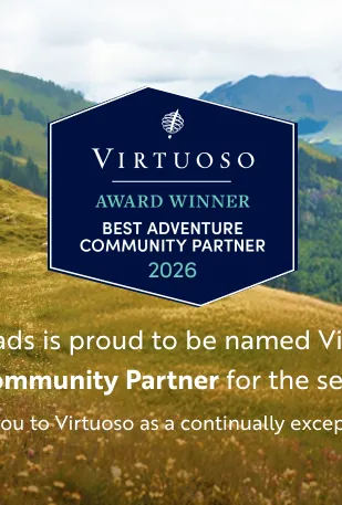 Backroads is proud to be a Virtuoso's Best Adventure Community Partner for the second year in a row, a huge thank you to Virtuoso as a continually exceptional partner is written over a hilly mountain side with 7 hikers walking down a trail.