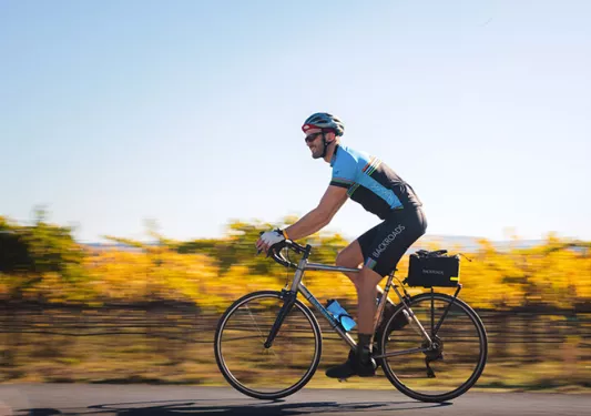 Young man biking in Napa