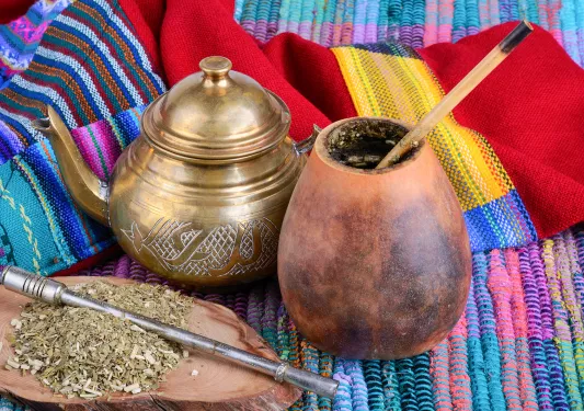 Close-up of dry yerba mate infusion pot and gourd.