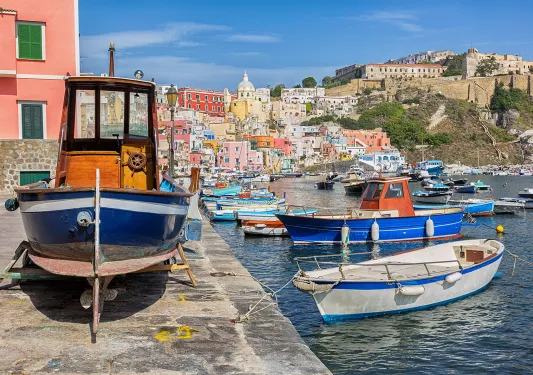 Pier on the Amalfi Coast, boast littering the water's edge.