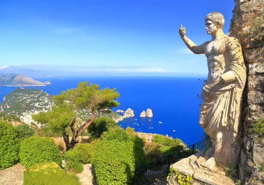 Wide shot of statue at Monte Solaro peak.