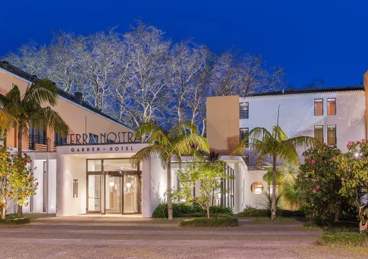 Exterior shot of Terra Nostra hotel at night.