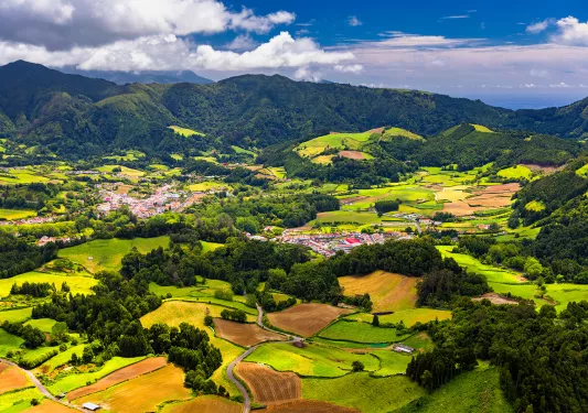 Aerial view of Lagoa das Furnas located on the Azorean island of Sao Miguel, Azores, Portugal. Lake Furnas (Lagoa das Furnas) on Sao Miguel, Azores, Portugal from the Pico do Ferro scenic viewpoint.