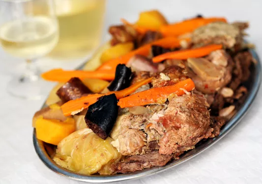 Traditional Portuguese dishes, the Azores, the region Furnas .Switch in restaurants, cooked in boilers The various types of meat and cabbage with potatoes and carrots.