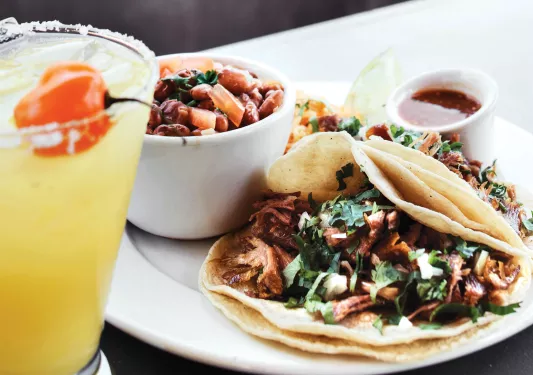 Plate of mushroom tacos and a margarita.