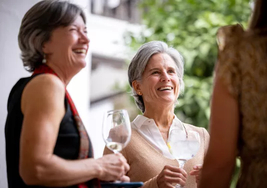 Two women having a glass of wine.