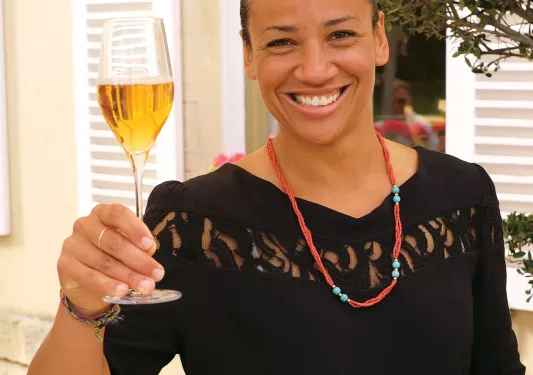 Backroads Guest Smiling with Wine