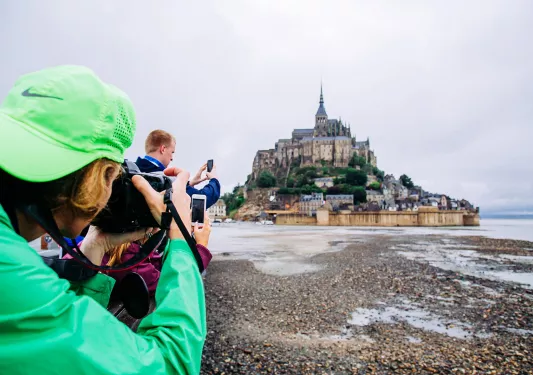 Backroads Guests Taking Photos of Le Mont Saint-Michel Tidal Island 