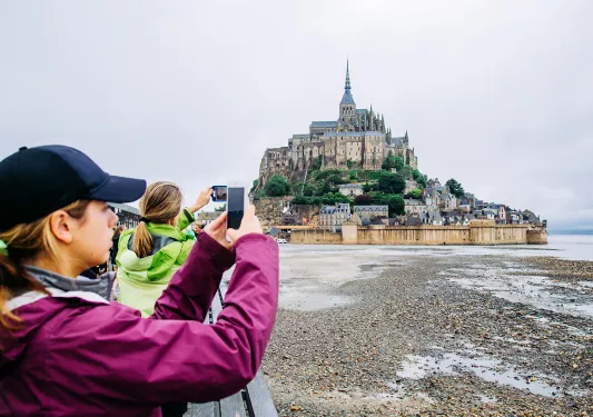 Backroads Guests Taking Photos of Le Mont Saint-Michel Tidal Island 