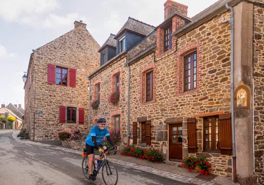Backroads Guest Biking Through Town