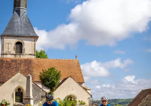 Two Backroads Guests Biking Through Town in Burgundy