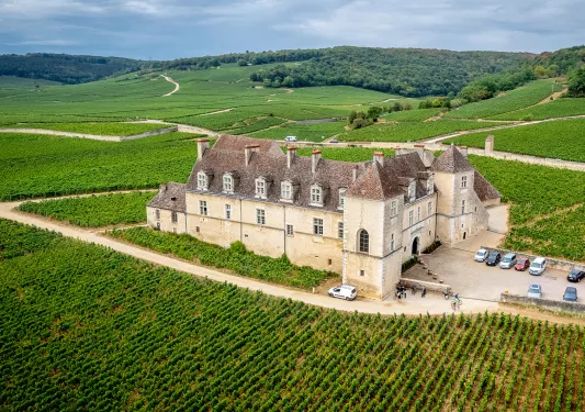 Building Surrounded by Fields and Hills