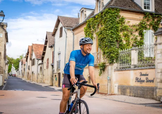 Backroads Guest Biking Through Town