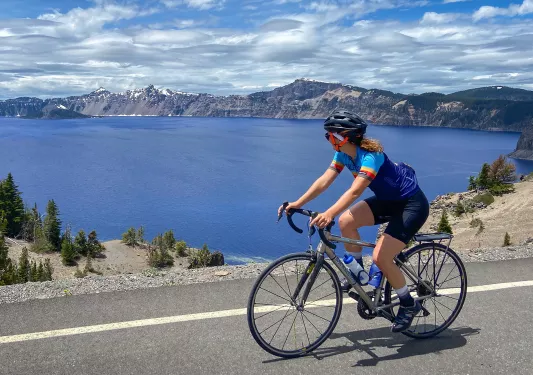 Guest cycling past Crater Lake.