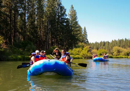 Group of guests in rafts.