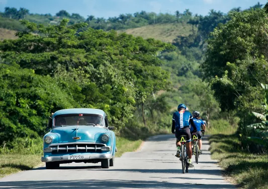 Cycling Past Classic Car
