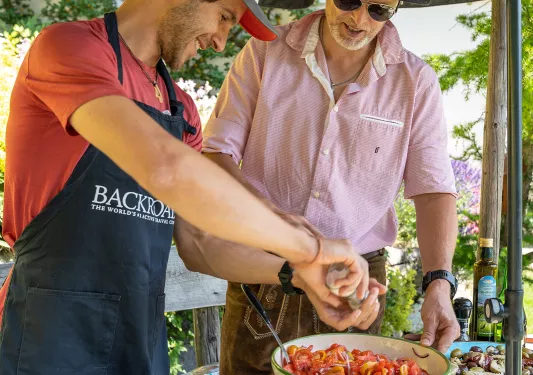 Leader & guide seasoning bowl of tomatoes. 