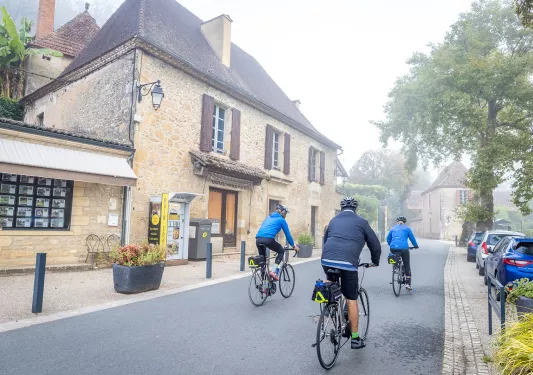 Backroads Guests Biking Through Town