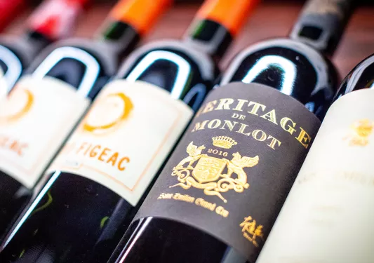 Close-up of red wine bottles. 