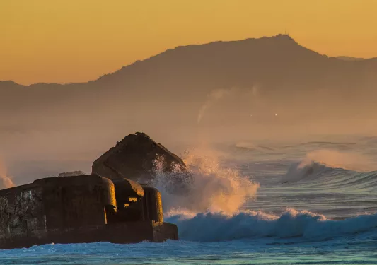 Water Crashing in Front of Mountains